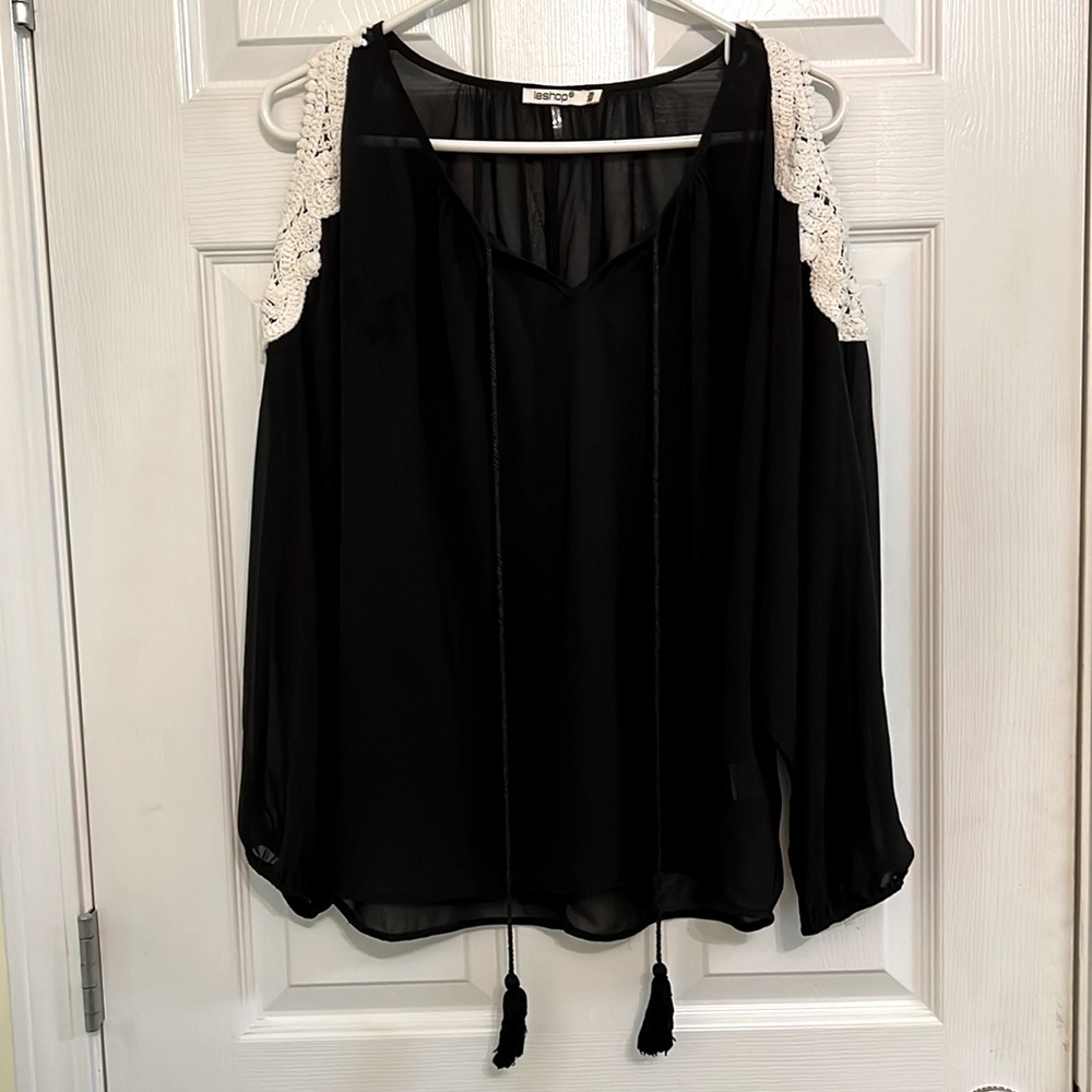 leshop black sheer top with shoulder cutouts featuring white crochet detail.